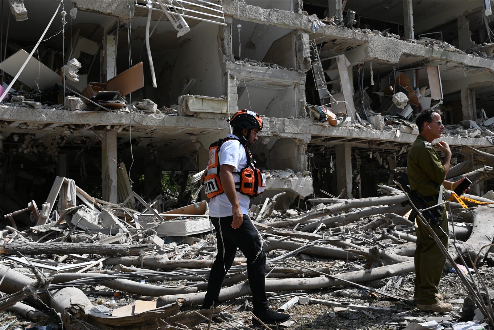 A ZAKA volunteer moving through the rubble