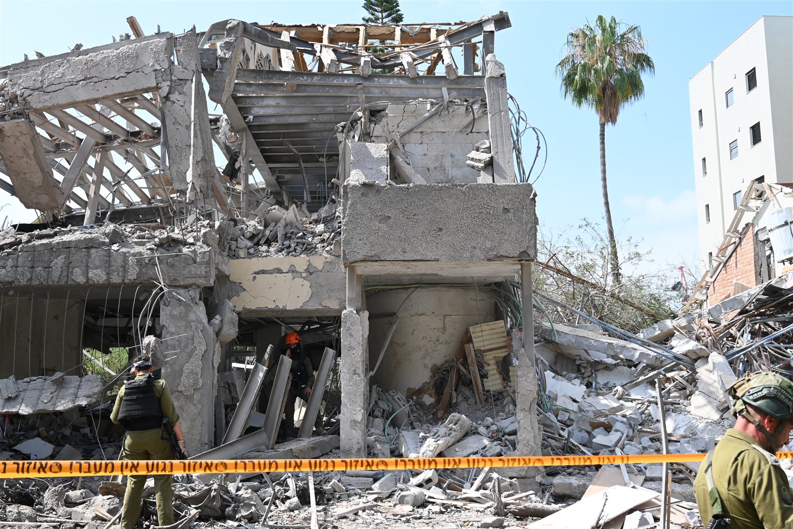 ZAKA volunteers searching a destroyed building